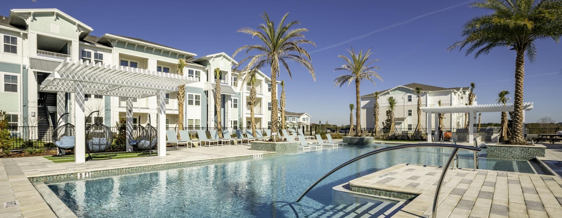 resort-style pool with palm trees