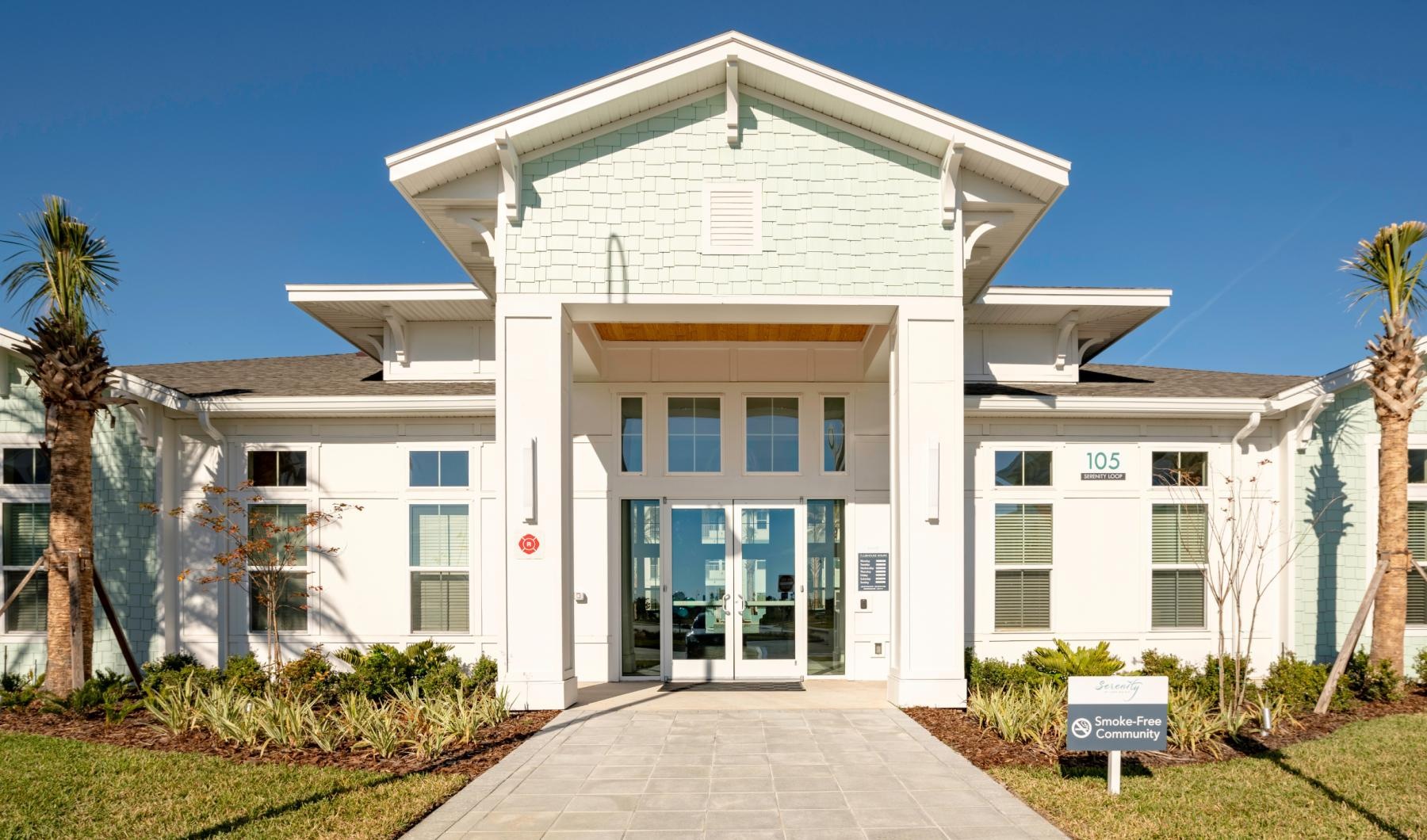 a white building with a sign in front of it