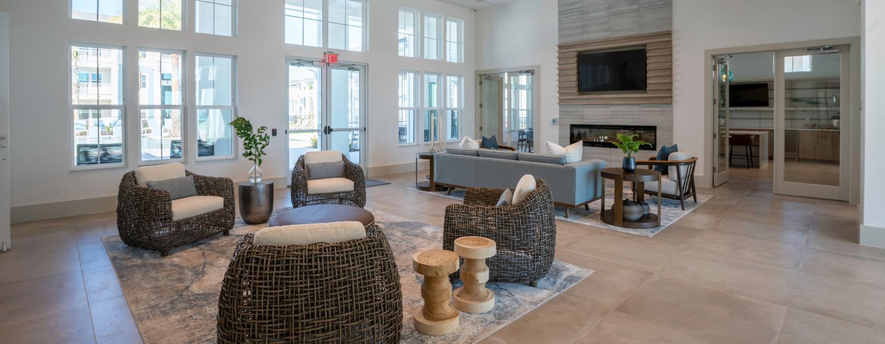 a lobby with a large rug and a large window