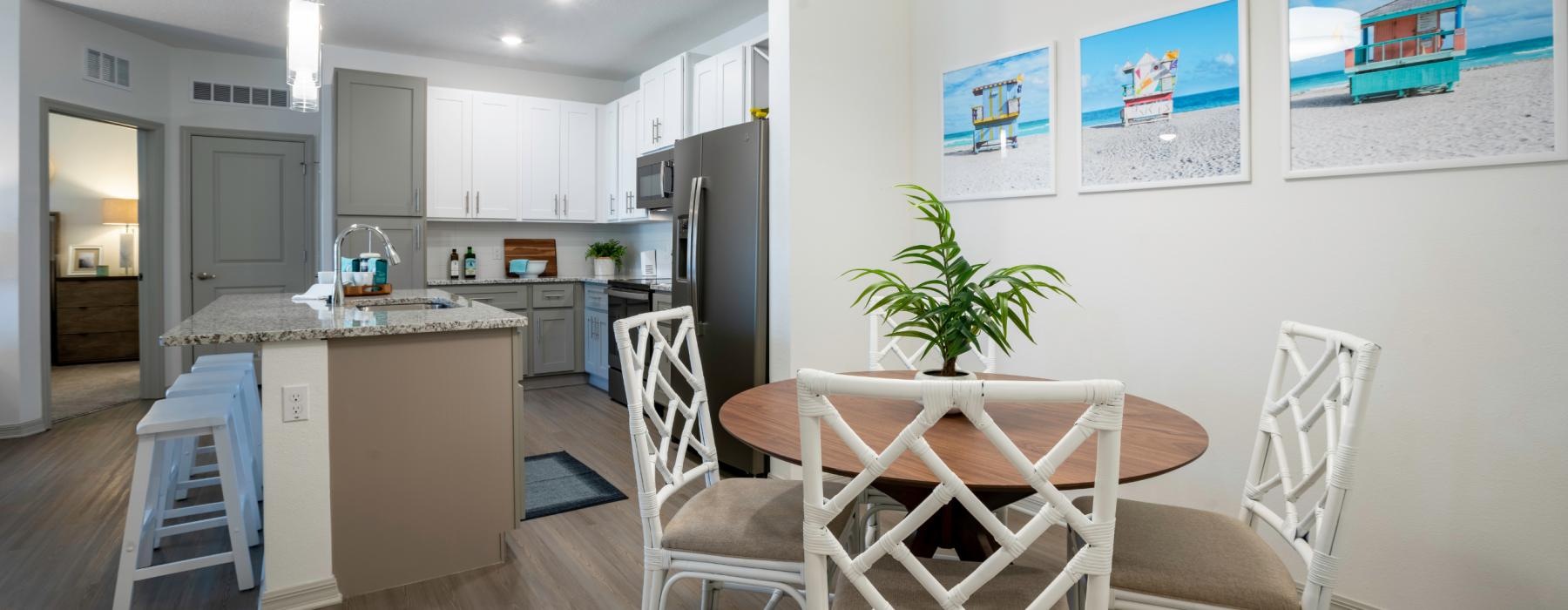 a kitchen with a table and chairs